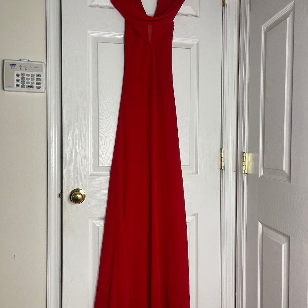 Seasons Designs Inc. Classy red gown with low cut back